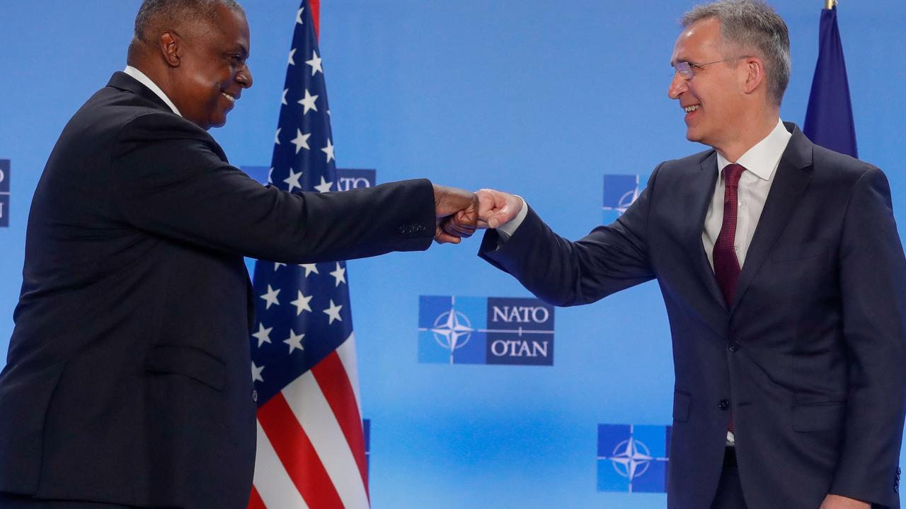 NATO Secretary-general Jens Stoltenberg (R) greets US Secretary of Defence Lloyd J. Austin III prior to the meeting of NATO defence ministers. Picture: Stephanie LECOCQ / AFP