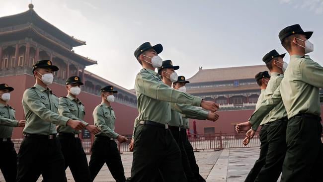 People's Liberation Army soldiers march in Beijing. Picture: AFP