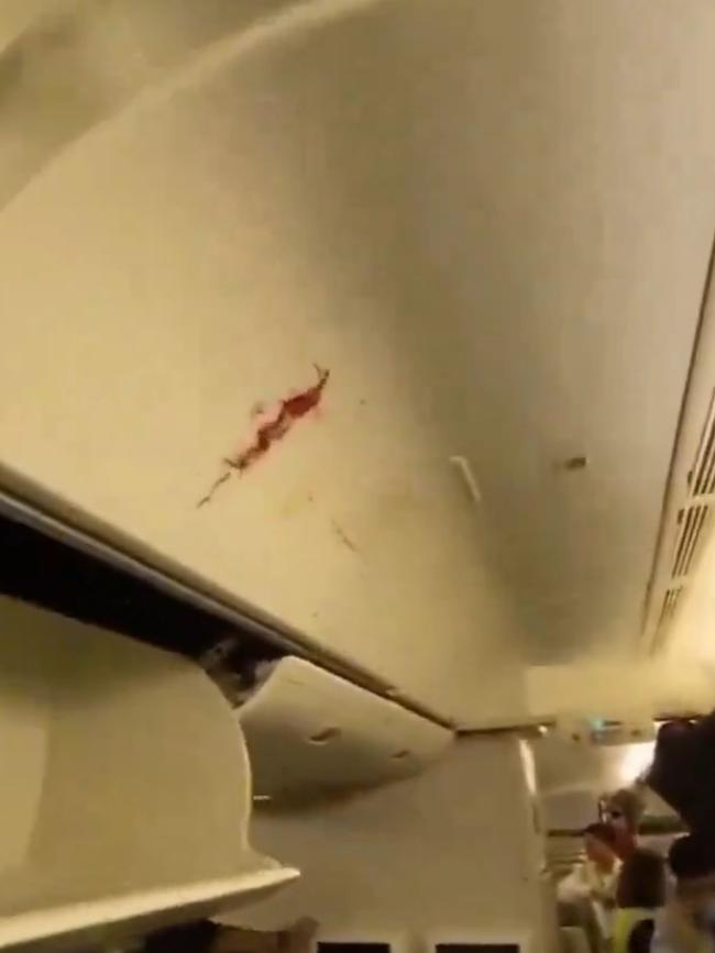 Blood on the bins: turbulence can cause severe head injuries, particularly if passengers are not secured. Picture: Twitter/X