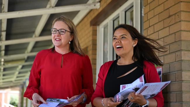 Victorian Premier Jacinta Allan (left) and Labor candidate for Mulgrave, Eden Foster (right) hand out how to vote cards at the Mulgrave Primary School voting centre in Mulgrave, Melbourne, Saturday, November 18, 2023. (AAP Image/James Ross)