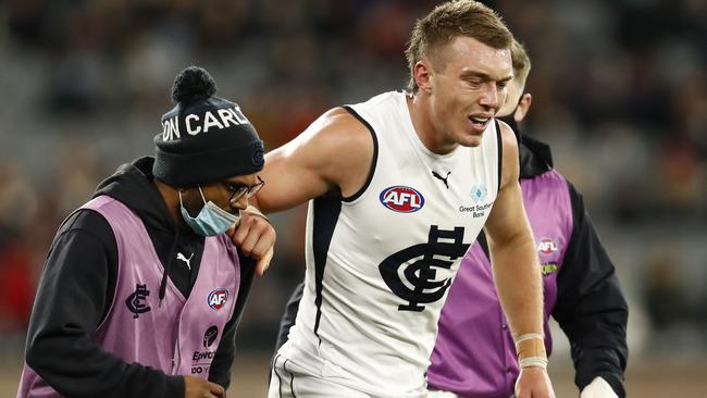 Patrick Cripps is helped trainers after hurting his lower leg before returning to see out the game. Picture: Getty Images