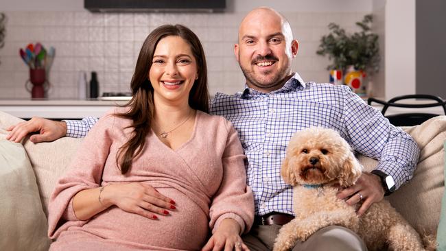 Radio presenter Stacey Lee, her husband Ben & their pet dog Murray. Picture: Tim Joy