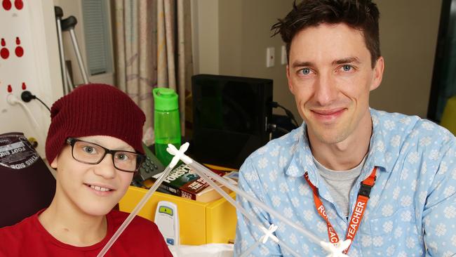 Oliver Harris has been nominated for a PRide of Australia Medal. He is the teacher at the Royal Children's Hospital and devotes his time to nurturing, entertaining and educating children whiole they are at the RCH, giving them an important piece of normal life. Oliver is with bone cancer patient'student Nathan Forsyth 13 yrs Picture: Norm Oorloff