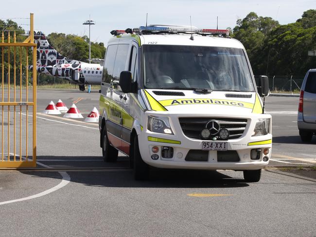 Border Force attend Cairns Airport as an  Ambulance collects a patient from Nauru who was being treated with a ventilator.  PICTURE: ANNA ROGERS