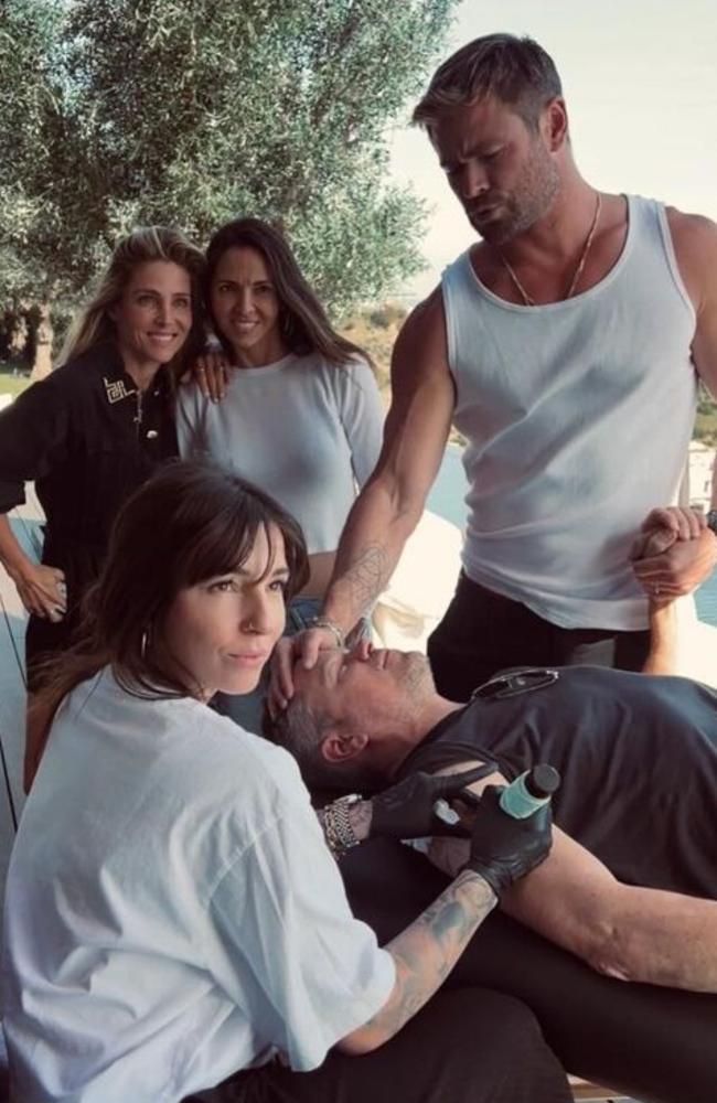 Chris Hemsworth was sen holding tightly onto fellow Hollywood star Matt Damon's hand while the actor got tattooed before the Oscars. Picture from Instagram.