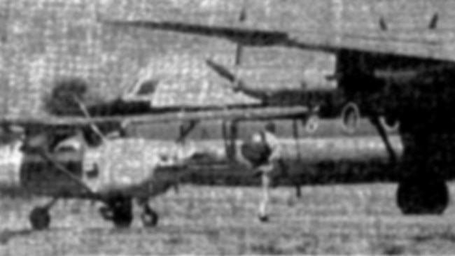 A passenger takes a parachute from the Cessna to the hijacked Ansett Fokker Friendship Turboprop hijacking in 1972. Picture: File