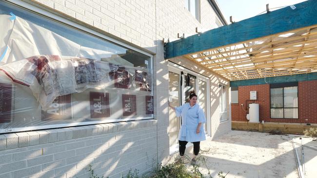 Porter Davis customer Kate Saha with her unfinished house. Picture: Mark Wilson