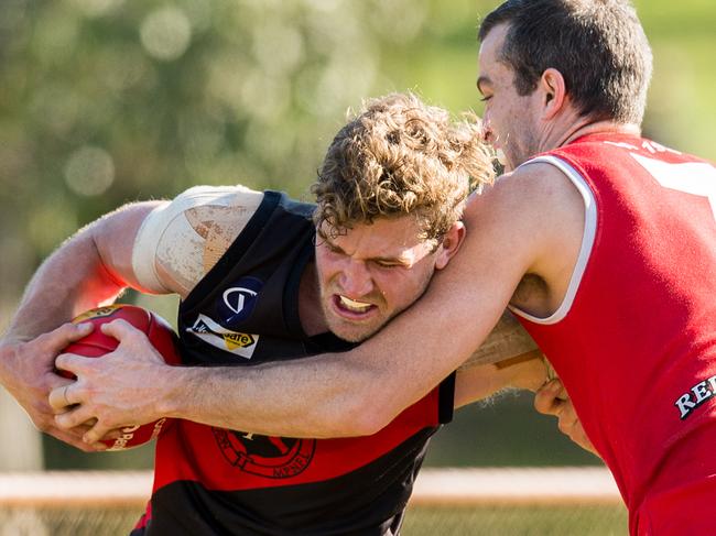 Nepean footy: Frankston v Red Hill at Greg Beck Oval. Michael Dillon of Red Hill tackles Frankston's James Degenhardt. Picture Stuart Walmsley