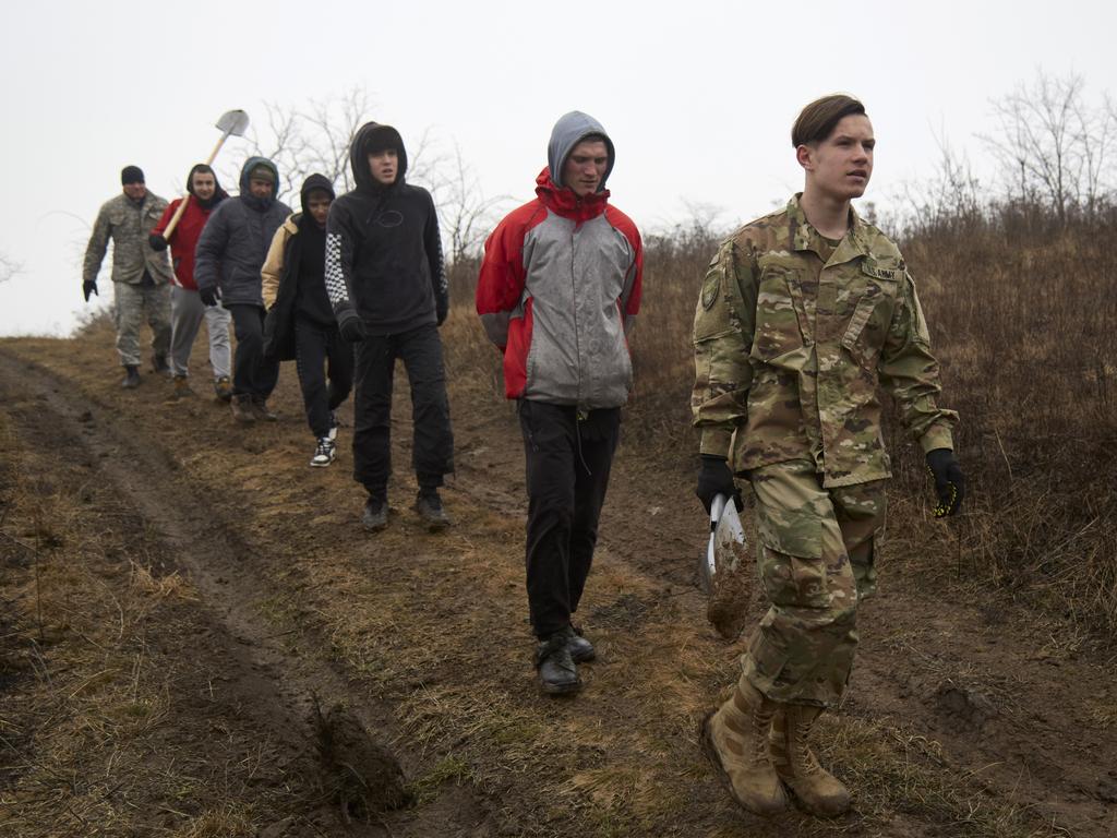 Citizens walk back home from the trenches in Mariupol, Ukraine. Picture: Getty Images