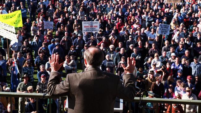 Former PMr John Howard showing the bulge of a suspected bullet proof vest under his jacket while addressing an anti-gun control law demonstration in Victoria,