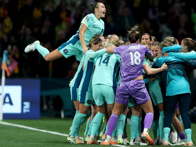 MELBOURNE, AUSTRALIA - JULY 31: Australia players celebrate the team's fourth goal scored by Steph Catley (obscured) during the FIFA Women's World Cup Australia & New Zealand 2023 Group B match between Canada and Australia at Melbourne Rectangular Stadium on July 31, 2023 in Melbourne, Australia. (Photo by Robert Cianflone/Getty Images)