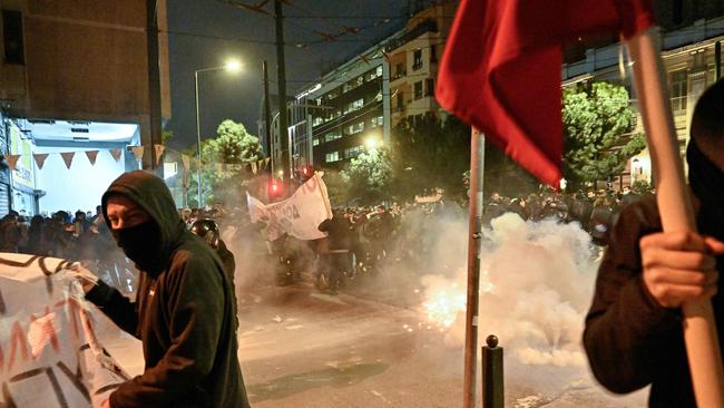 Protesters clash with police outside the Hellenic Train headquarters. Hundreds took to the streets in Athens, blaming the government for the privatisation of the Hellenic Train company. Picture: AFP