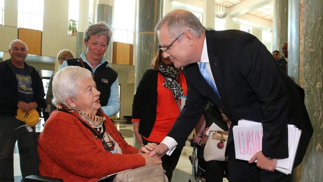 Treasurer Scott Morrison meet pensioners on his way to deliver his post-Budget Press Club address in the Great Hall of Parliament House, Canberra. Picture: Ray Strange