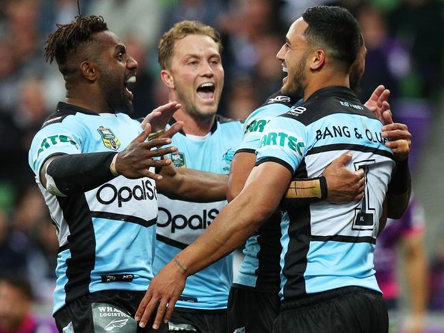 MELBOURNE, AUSTRALIA - AUGUST 12:  Valentine Holmes of the Sharks is congratulated by his teammates after scoring a try during the round 22 NRL match between the Melbourne Storm and the Cronulla Sharks at AAMI Park on August 12, 2018 in Melbourne, Australia.  (Photo by Graham Denholm/Getty Images)