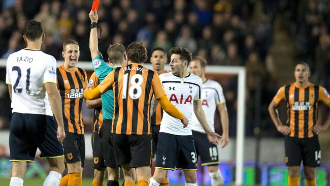 Referee Craig Pawson shows Hull City's Uruguayan midfielder Gaston Ramirez a red card.