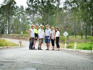 Woolooga residents standing on the Running Creek bridge wanting an upgrade are Phil Stanford, Steve Turner, Sean Barrett, Nevile and Joy Turner and Sharon Turner. Picture: Renee Albrecht