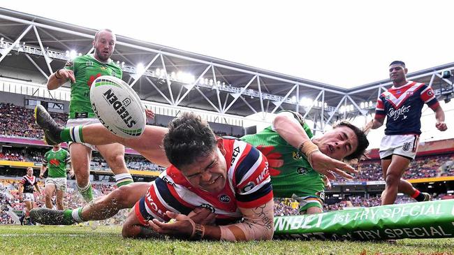 Latrell Mitchell of the Roosters scores a try during the Round 9 NRL match between the Sydney Roosters and the Canberra Raiders at Suncorp Stadium in Brisbane, Sunday, May 12, 2019.  (AAP Image/Dave Hunt) NO ARCHIVING, EDITORIAL USE ONLY. Picture: DAVE HUNT