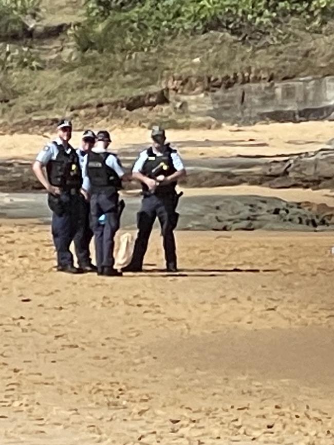 Police at the scene of a drowning at Spoon Bay, Forresters Beach in October 2021.