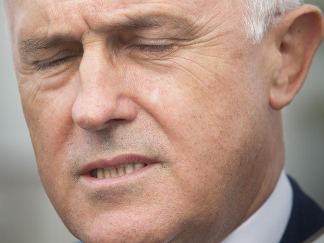 Daily Telegraph - Pictured: Malcolm Turnbull with eyes closed - Prime Minister Malcolm Turnbull and Defence Minister Marise Payne visited Holsworthy Army Barracks today. Photographs taken in the car park outside of the base.