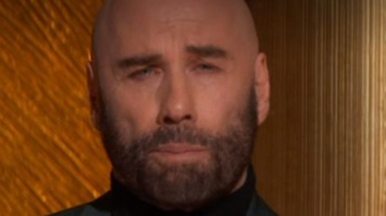 John Travolta breaks down onstage at Oscars