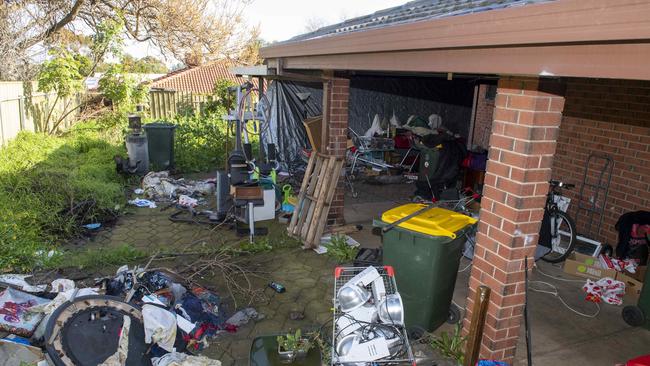 Rubbish, shopping trolleys and squalor in the overgrown backyard home of 7-year-old Makai, who died in February last year. Picture: Mark Brake