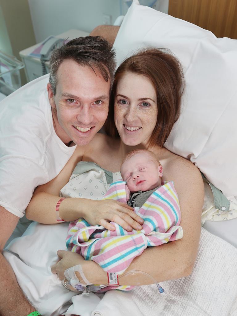 Krystle Henry, Matt Bridges and newborn Angus Bridges at the Mater hospital after the arrival of their baby on Tuesday. Picture: Annette Dew