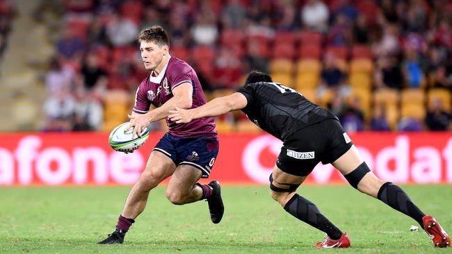 BRISBANE, AUSTRALIA - FEBRUARY 22: James O'Connor of the Reds takes on the defence during the round four Super Rugby match between the Reds and the Sunwolves at Suncorp Stadium on February 22, 2020 in Brisbane, Australia. (Photo by Bradley Kanaris/Getty Images)