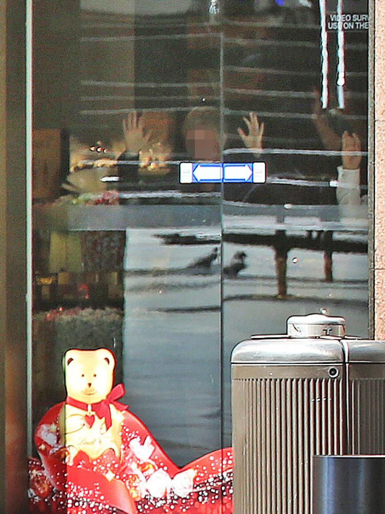 Hostages were forced to stand in front of the front doors and windows inside the Lindt cafe. Picture: Toby Zerna