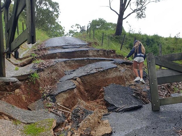 Dave Anderson’s kids climb the driveway at their Neranwood property after the land slip Picture: Supplied