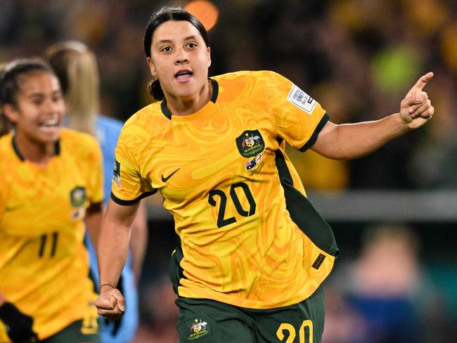 FILES-- This file photo taken on August 16, 2023 shows Australia's forward Sam Kerr celebrating scoring her team's first goal during the Australia and New Zealand 2023 Women's World Cup semi-final football match between Australia and England at Stadium Australia in Sydney. Chelsea and Australian women's football star Sam Kerr has been charged with a "racially aggravated offence" in Britain following a dispute involving a police officer, London's Metropolitan Police said March 4.  The 30-year-old striker, one of the highest profile and best-paid players in the women's game, was charged following an incident in London in January 2023, a police statement read. (Photo by IZHAR KHAN / AFP)