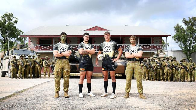 Private Alex Pilliris from the 3rd Battalion, Cowboys players Jamayne Taunoa-Brown and Wil Sullivan, and Private Luke Turch from the 3rd Battalion wearing the 2024 Defence Jerseys. Picture: Shae Beplate.