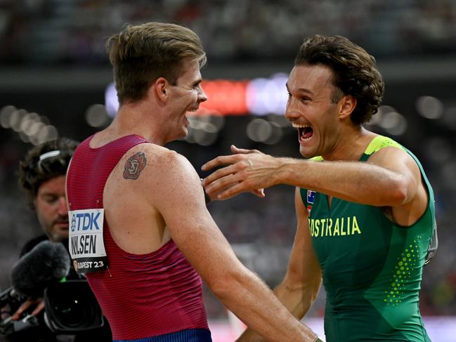 BUDAPEST, HUNGARY - AUGUST 26: Kurtis Marschall of Team Australia reacts with Christopher Nilsen of Team United States after the Men's Pole Vault Final during day eight of the World Athletics Championships Budapest 2023 at National Athletics Centre on August 26, 2023 in Budapest, Hungary. (Photo by Hannah Peters/Getty Images)