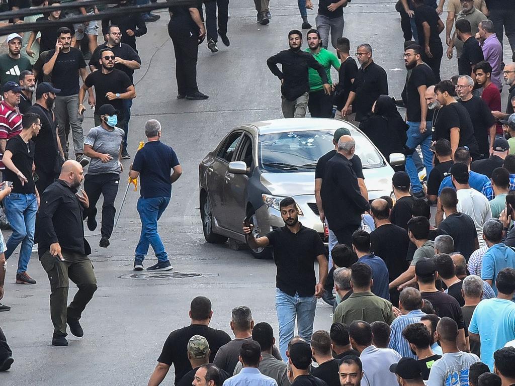 Mourners react after an explosion during the funeral of those killed when hundreds of paging devices exploded across Lebanon. Picture: AFP