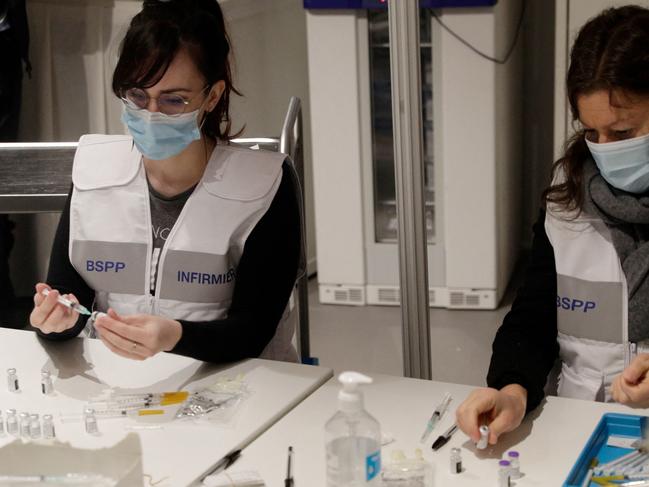 Nurses prepare doses of Pfizer-BioNTech vaccine at a vaccination centre in Paris. Picture: AFP