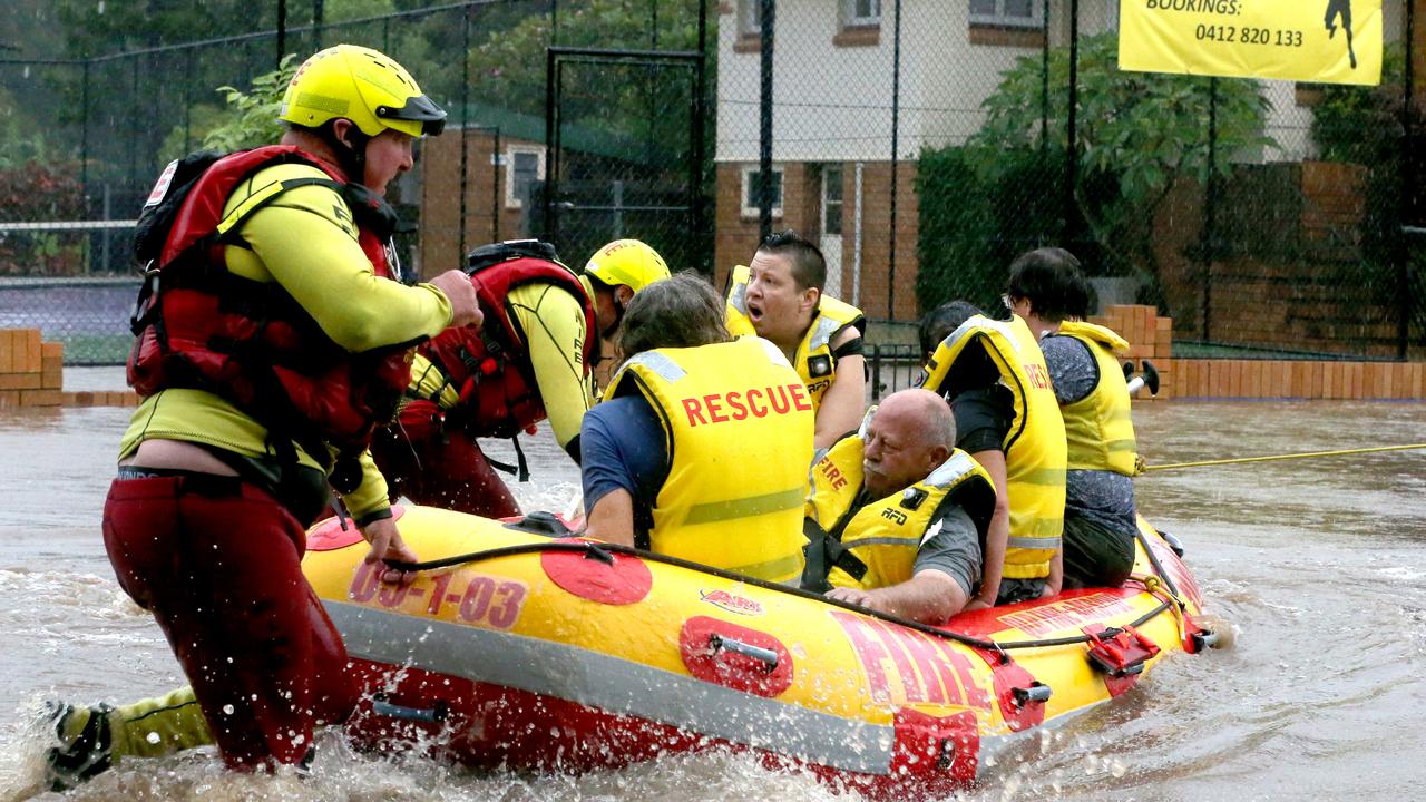 People are rescued from flooded homes in Brisbane. Picture: Steve Pohlner