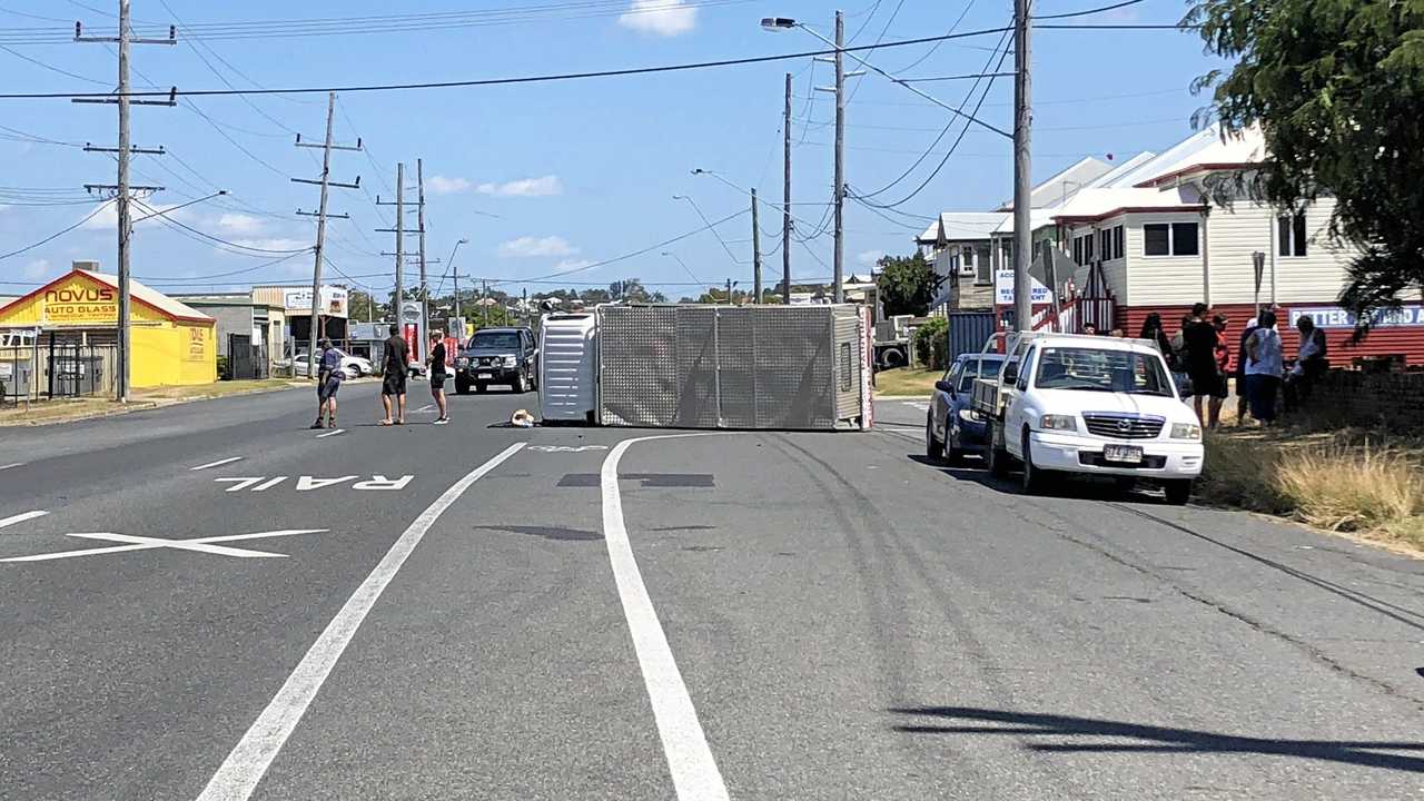 CRASH: A man in his 50's was assisted by people after his vehicle rolled at the corner of Kent and Derby St. Picture: Maddelin Mccosker