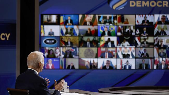 US President Joe Biden looks at a video screen displaying the participants in the Summit for Democracy last week. Picture: AFP