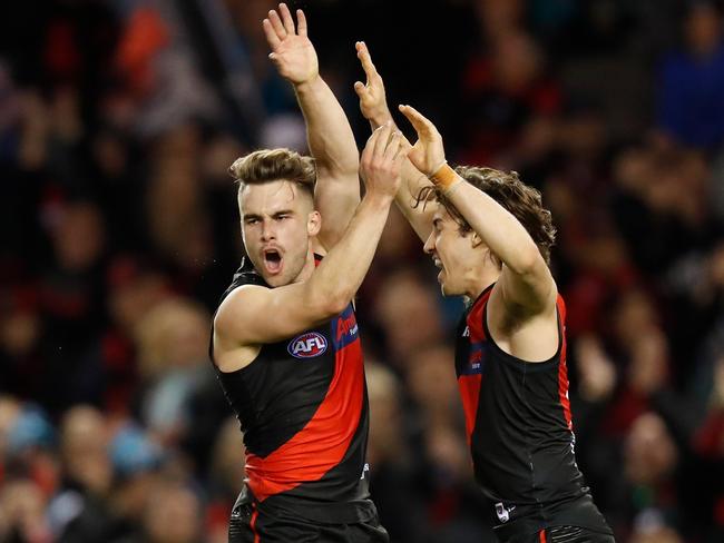 Will Snelling (left) and Andrew McGrath of the Bombers celebrate during the Round 20 match against Port Adelaide at Marvel Stadium. Picture: Michael Willson/AFL Photos via Getty Images