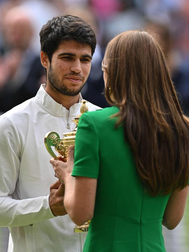 Catherine, Princess of Wales (R), presents the winner's trophy to Spain's Carlos Alcaraz. Picture: AFP.