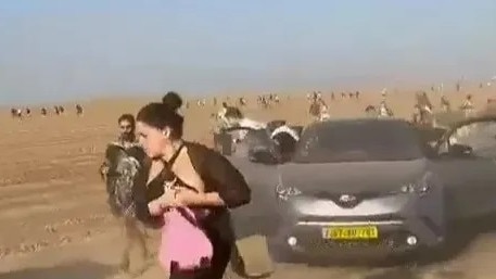 Footage showed terrified ravers fleeing festival as Hamas open fired.