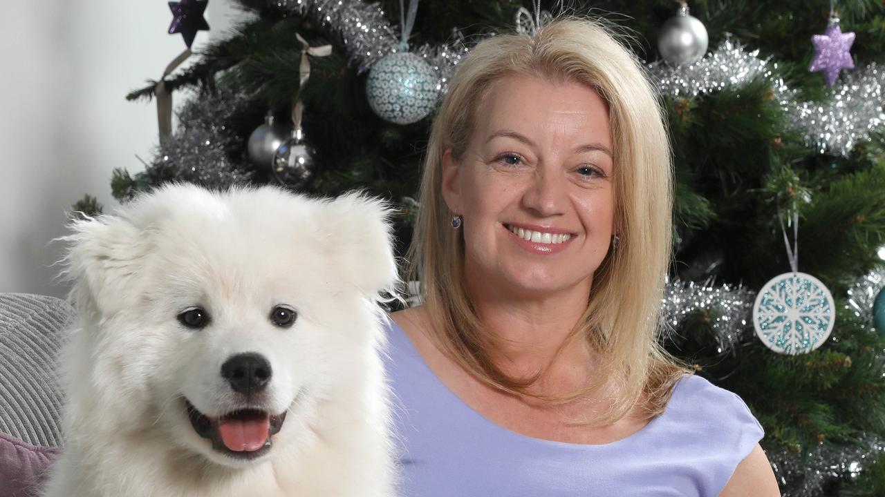 Natalie Joyner, pictured with her dog Ziggy, is happy to use points to buy products. Picture: Dean Martin