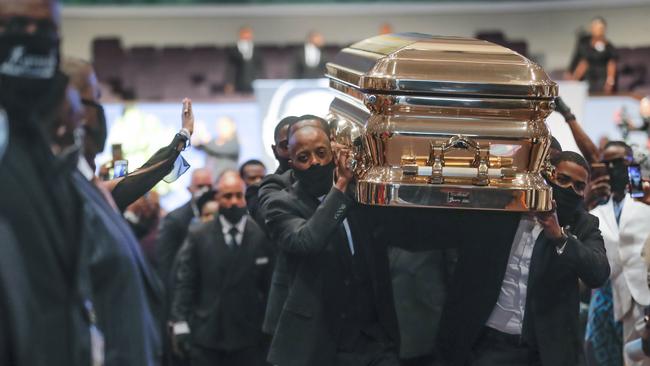 Pallbearers carry the casket following the funeral for George Floyd at The Fountain of Praise church in Houston.