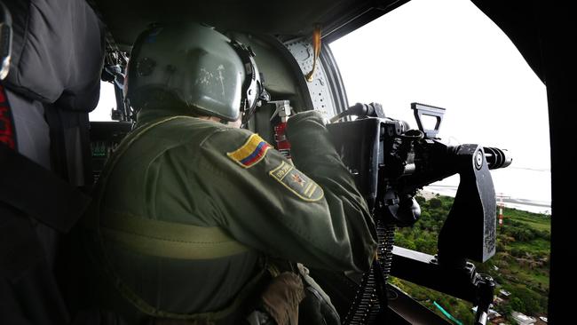 National Narcotics personnel in Tumaco during an irradiation cocaine plantation operation. Picture Gary Ramage