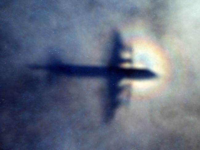 The shadow of a Royal New Zealand air force P3 Orion is seen on low level cloud while the aircraft searches for missing Malaysia Airlines Flight MH370 in the southern Indian Ocean. The search was the largest in aviation history. Picture: AP