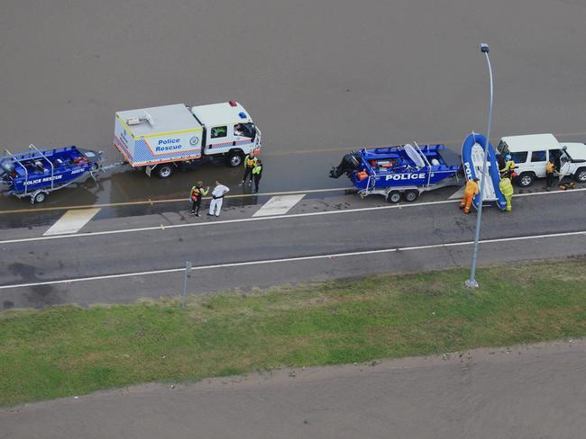 NSW Rescue workers searching for two people swept away in a car from the causeway on Cessnock Road, Maitland today. Picture: Adam Taylor