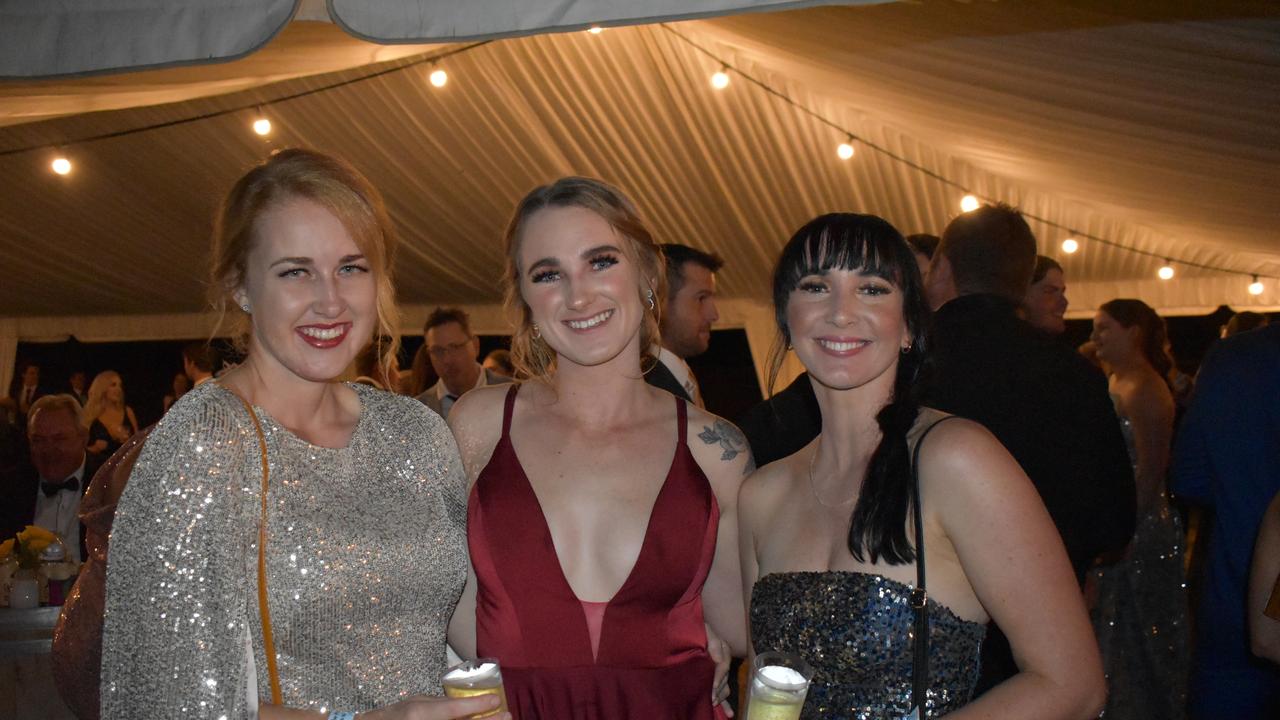 Kate van Dalen of Proserpine, Renee Kuhn of Bowen, and Emily Shaw of Bowen at the 2021 Proserpine Show Ball. Picture: Kirra Grimes.