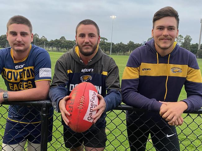 Josh Johns (middle) with his brother Zakk (left) and his ruckman Daniel Webster.