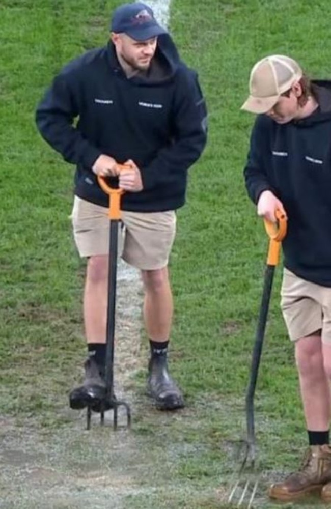 Allianz ground staff were frantically using pitchforks to try and drain water during the Roosters v Eels clash. Picture: Fox Sports.