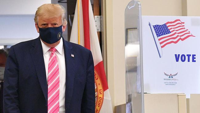 Donald Trump leaves the polling station after casting his ballot at the Palm Beach County Public Library in Florida on Sunday. Picture: AFP