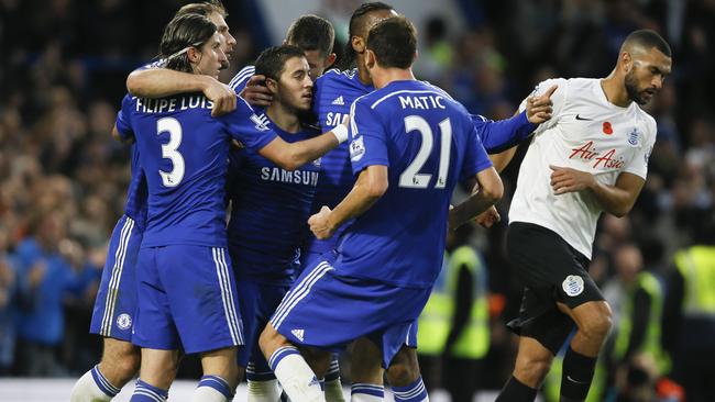 Chelsea's Eden Hazard, centre, celebrates with teammates after scoring.